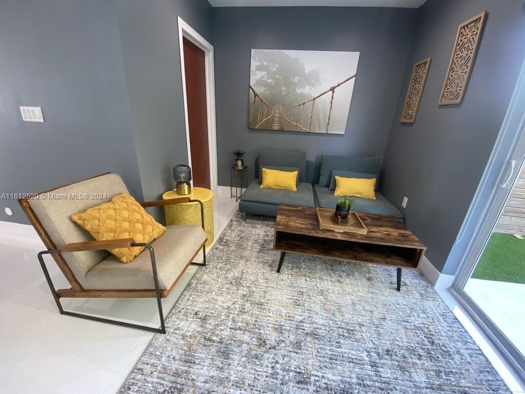 3445 Southwest 14th Street, Unit 3445 Miami, FL 33145 - Photo 29 of 52 a living room with furniture and rug