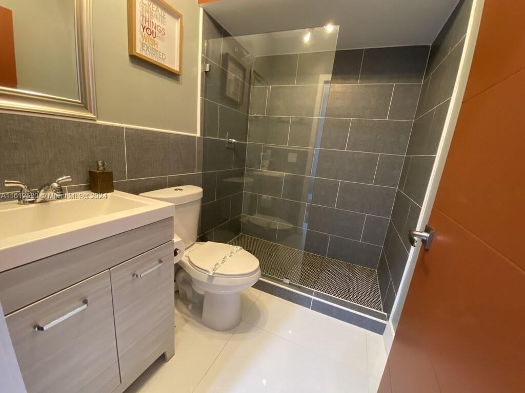 3445 Southwest 14th Street, Unit 3445 Miami, FL 33145 - Photo 32 of 52 a bathroom with a sink and a toilet