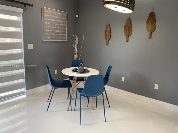 a reading room with furniture and rug