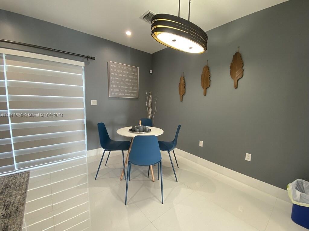 3445 Southwest 14th Street, Unit 3445 Miami, FL 33145 - Photo 35 of 52 a view of a room with furniture and wooden floor