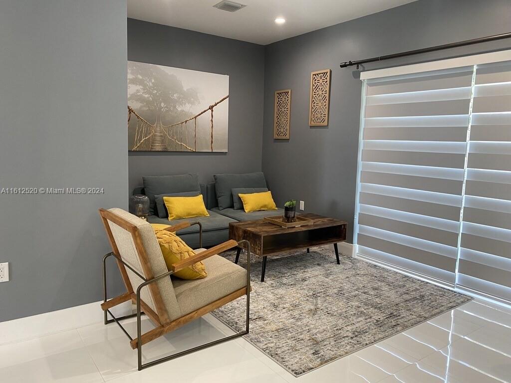 3445 Southwest 14th Street, Unit 3445 Miami, FL 33145 - Photo 36 of 52 a reading room with furniture and rug