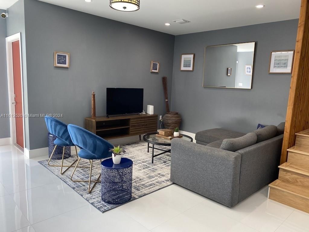 3445 Southwest 14th Street, Unit 3445 Miami, FL 33145 - Photo 49 of 52 a living room with furniture and a flat screen tv