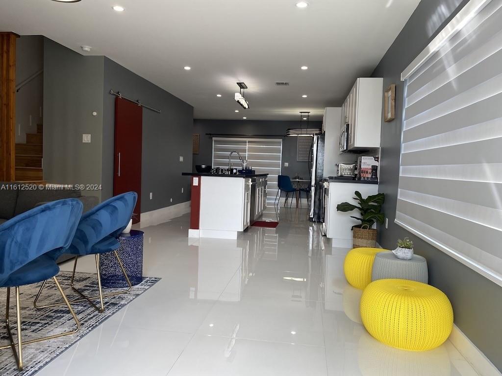 3445 Southwest 14th Street, Unit 3445 Miami, FL 33145 - Photo 50 of 52 a kitchen with a table and chairs in it