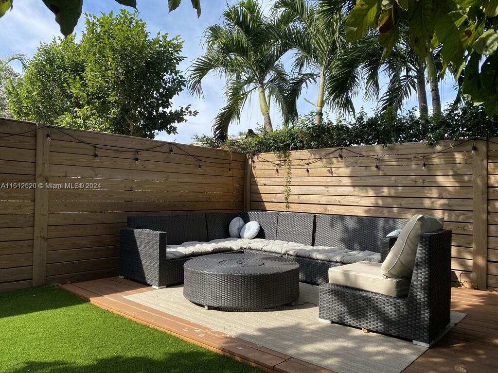 3445 Southwest 14th Street, Unit 3445 Miami, FL 33145 - Photo 5 of 52 a view of a patio with couches and a fire pit