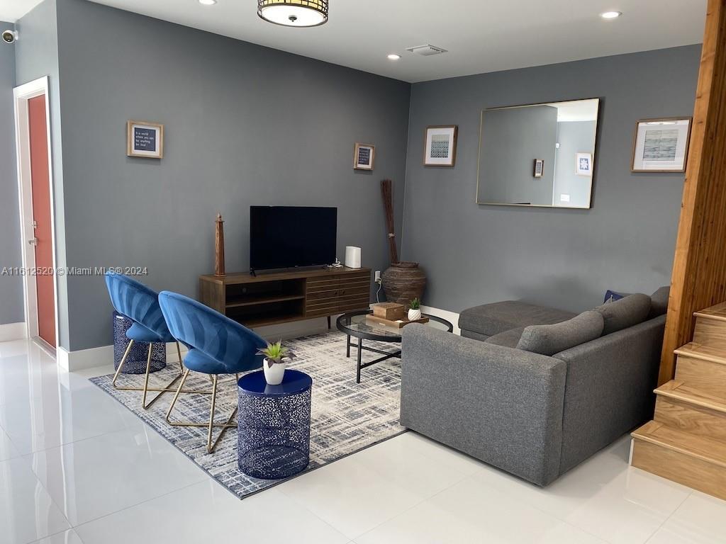 3445 Southwest 14th Street, Unit 3445 Miami, FL 33145 - Photo 51 of 52 a living room with furniture and a flat screen tv