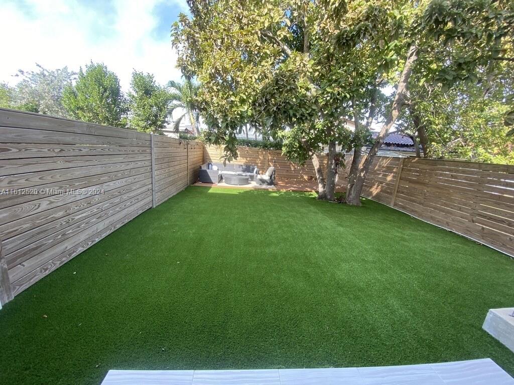 3445 Southwest 14th Street, Unit 3445 Miami, FL 33145 - Photo 8 of 52 a view of a backyard with a garden