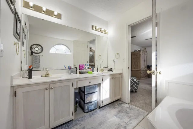 a bathroom with a bathtub and a shower