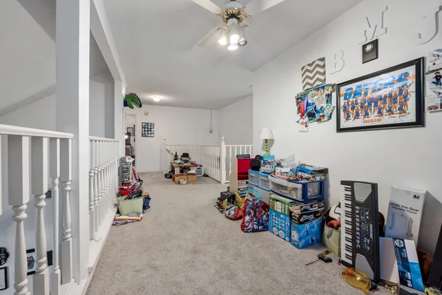 a bedroom with furniture and a book shelf