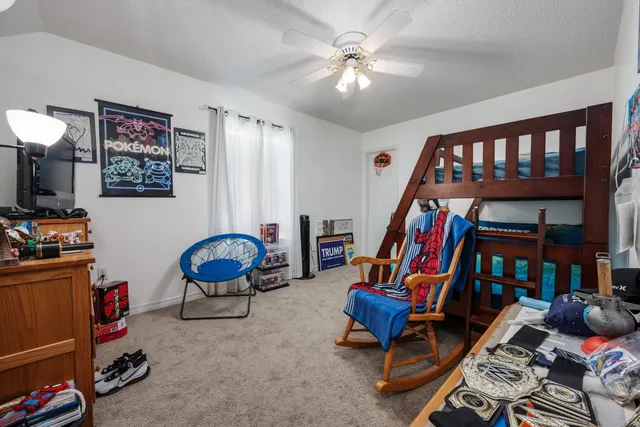 a view of a hallway with storage and utility room