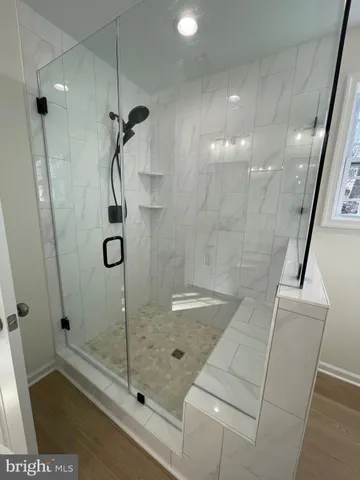 a view of entryway with wooden floor