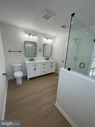 a view of entryway with wooden floor