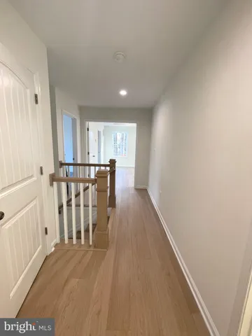a view of an entryway with wooden floor