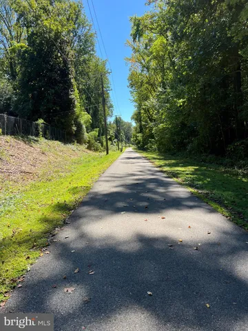 a view of a yard with yellow lighting