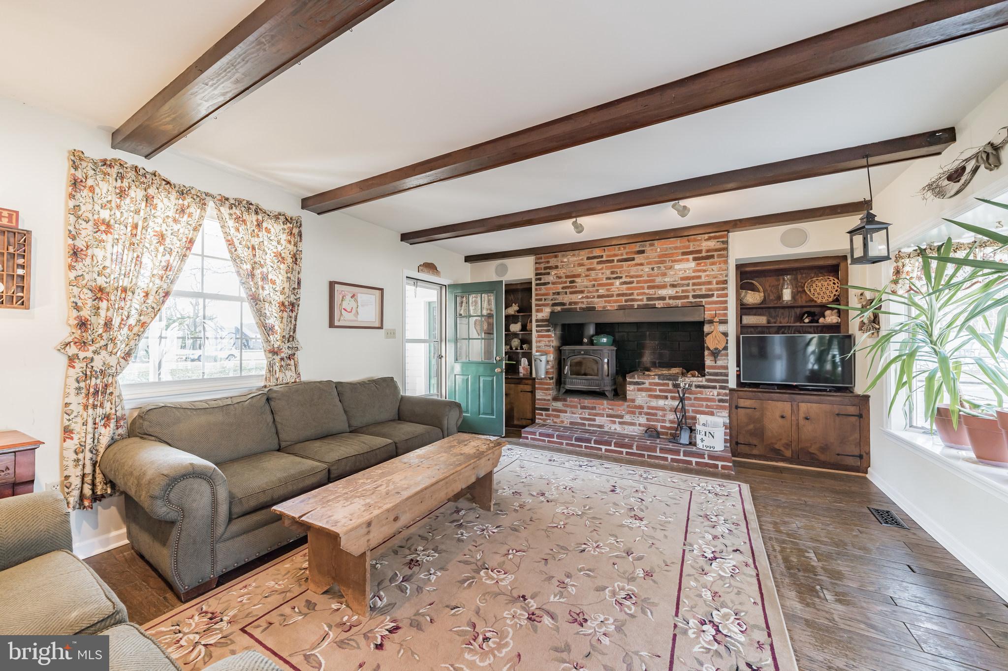 864 Nathan Hale Road Berwyn, PA 19312 - Photo 12 of 30 Family Room With Beam Ceiling and Fireplace