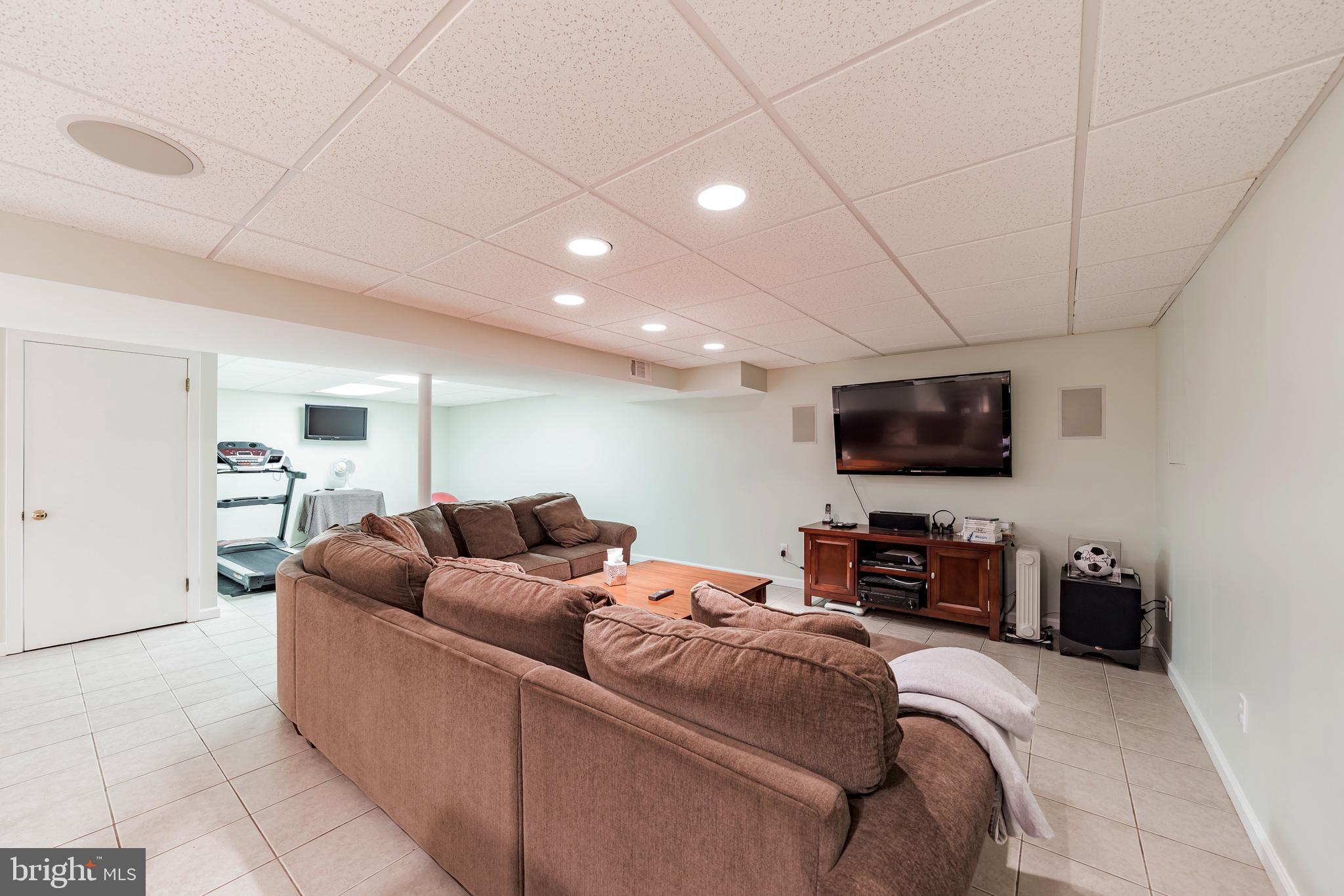 864 Nathan Hale Road Berwyn, PA 19312 - Photo 26 of 30 Basement TV area with Adjoining Fitness Space