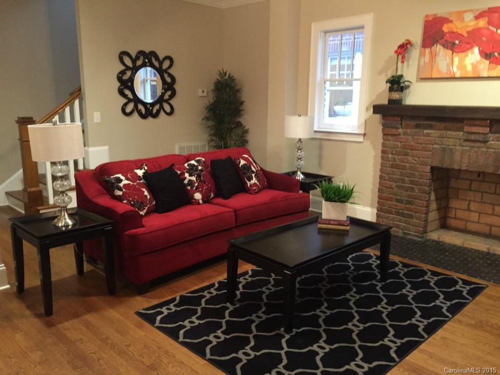 521 Grandin Road Charlotte, NC 28208 - Photo 2 of 23 a living room with furniture and a fireplace