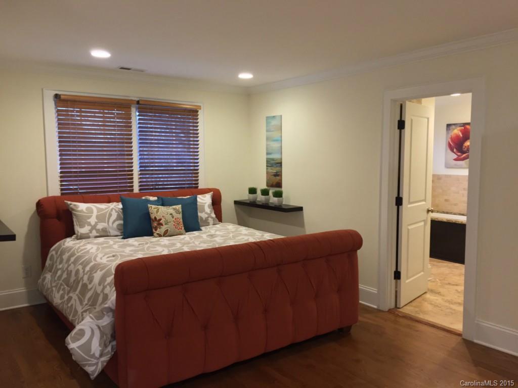 521 Grandin Road Charlotte, NC 28208 - Photo 13 of 23 a bedroom with a bed and a couch