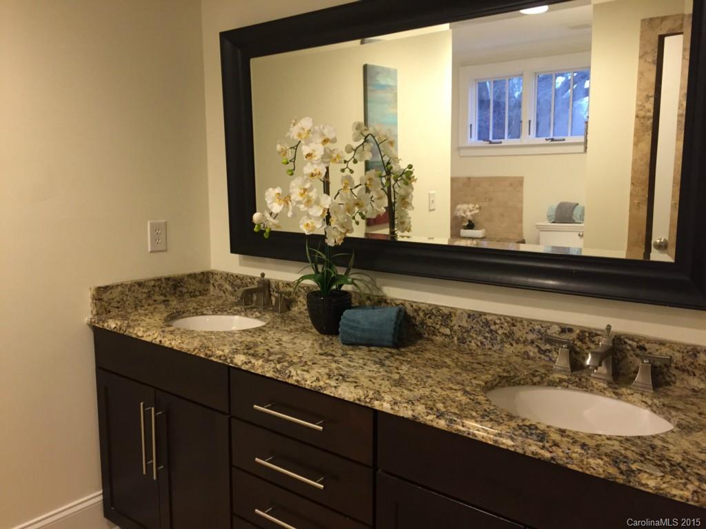 521 Grandin Road Charlotte, NC 28208 - Photo 14 of 23 a bathroom with a granite countertop sink and a mirror