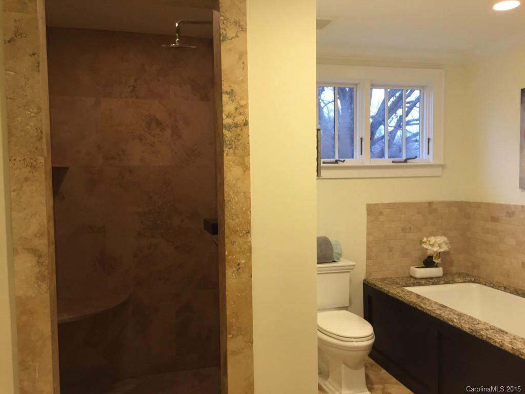 521 Grandin Road Charlotte, NC 28208 - Photo 15 of 23 a bathroom with a granite countertop toilet and a sink