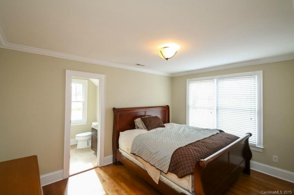 521 Grandin Road Charlotte, NC 28208 - Photo 18 of 23 a bedroom with a bed and a window