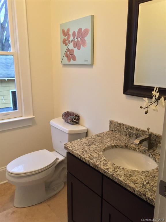 521 Grandin Road Charlotte, NC 28208 - Photo 19 of 23 a bathroom with a granite countertop sink and a mirror