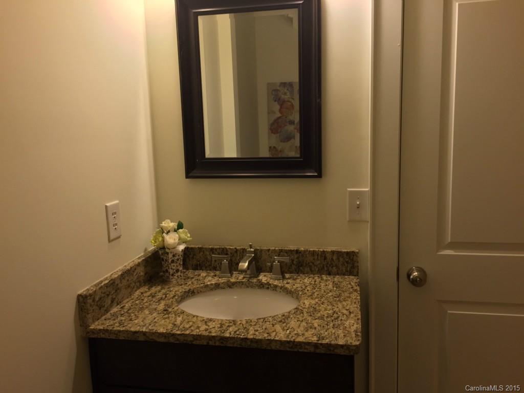 521 Grandin Road Charlotte, NC 28208 - Photo 10 of 23 a bathroom with a granite countertop sink and a mirror