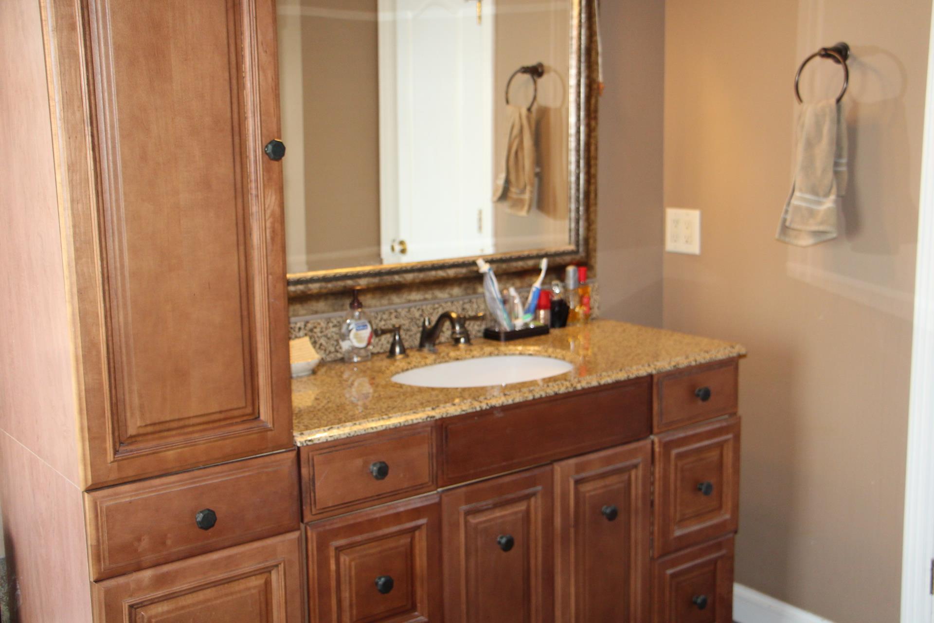 4373 Oregon Road Springfield, TN 37172 - Photo 14 of 18 a bathroom with a sink and a mirror