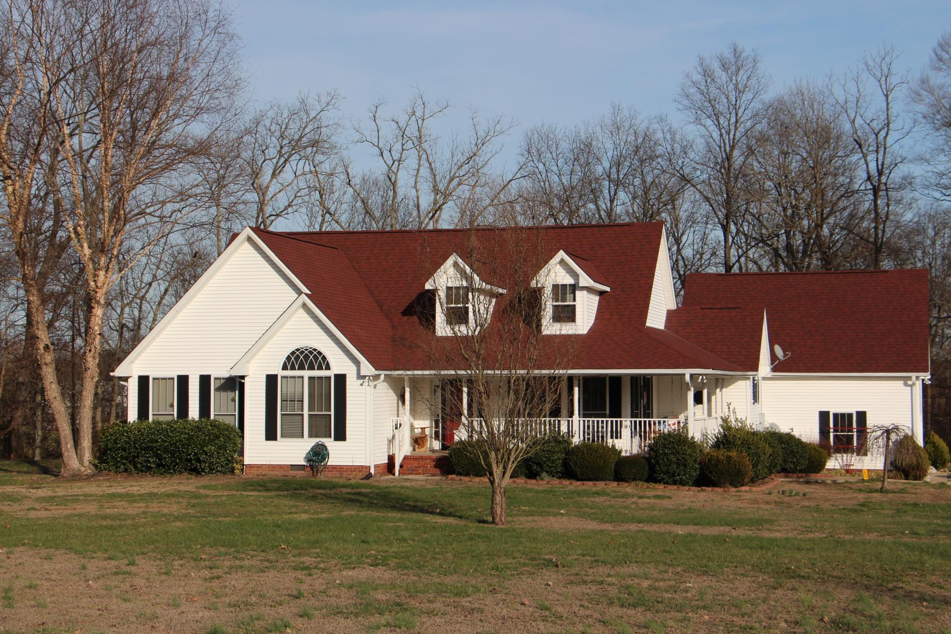 4373 Oregon Road Springfield, TN 37172 - Photo 2 of 18 a view of a white house with a yard and plants