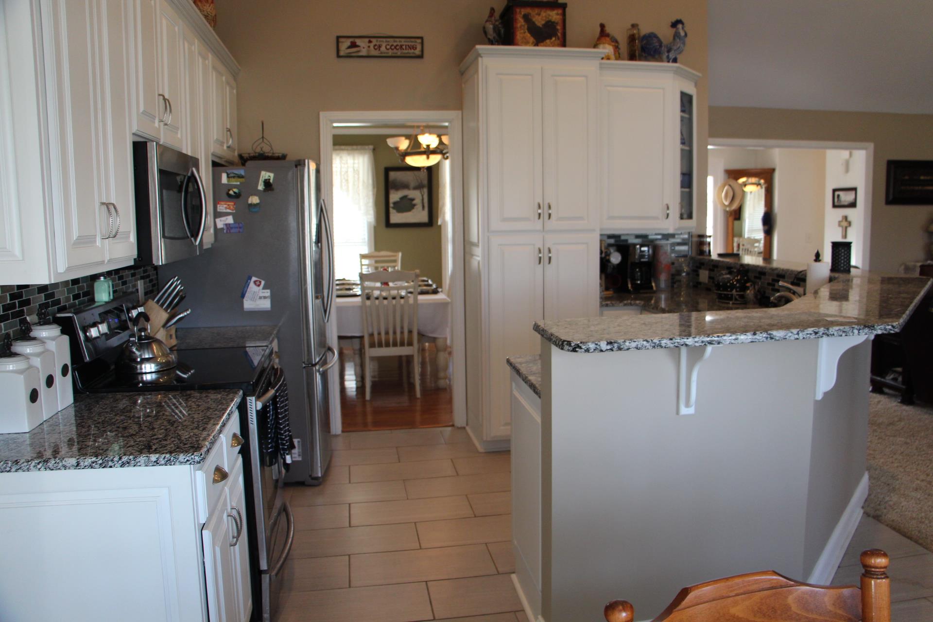 4373 Oregon Road Springfield, TN 37172 - Photo 6 of 18 a kitchen with stainless steel appliances granite countertop a sink stove and refrigerator