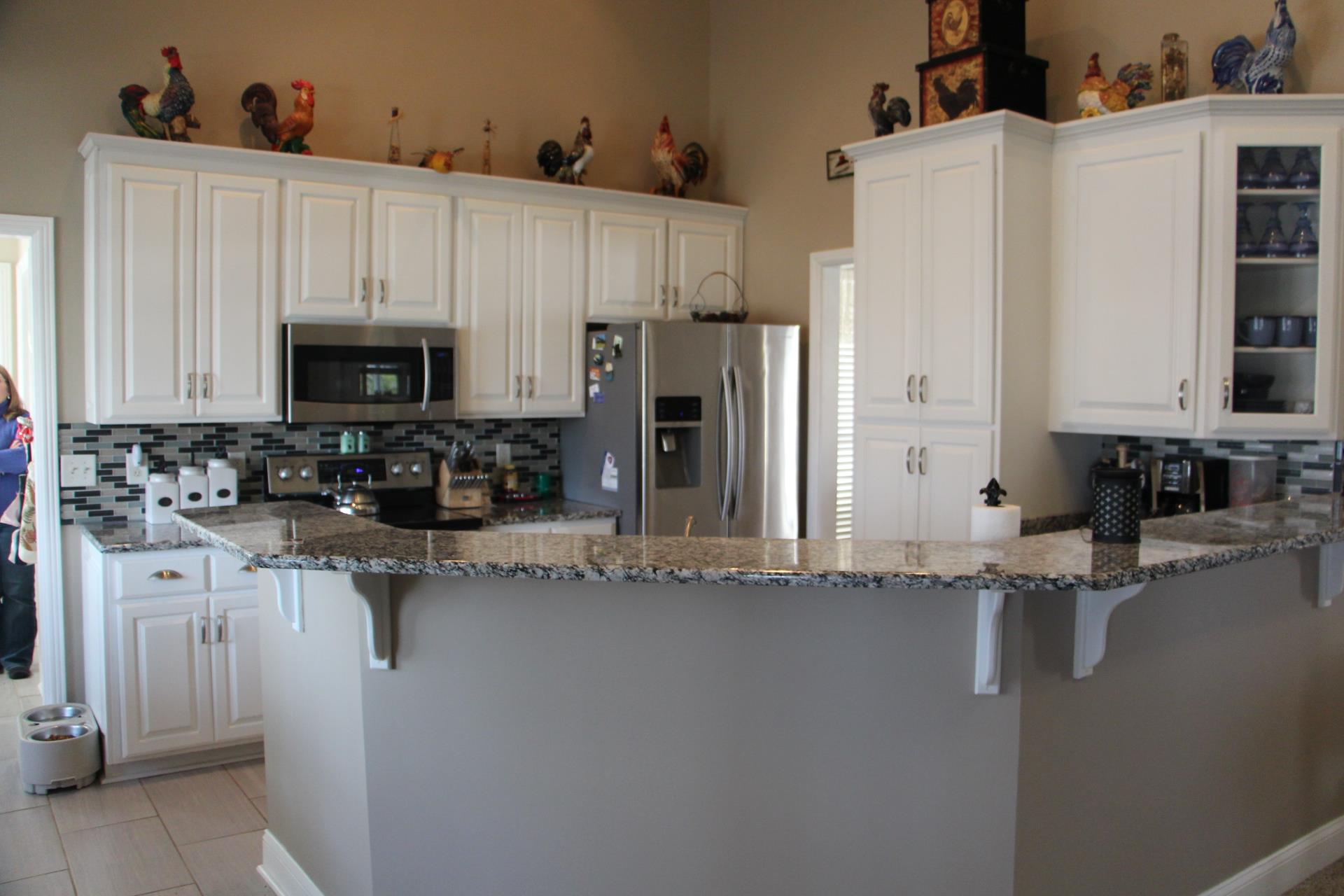 4373 Oregon Road Springfield, TN 37172 - Photo 7 of 18 a kitchen with stainless steel appliances granite countertop a refrigerator a stove and a sink