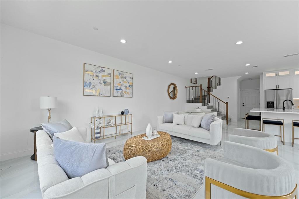 6230 Dewitt Street Sachse, TX 75048 - Photo 3 of 21 Living room with stairway and recessed lighting