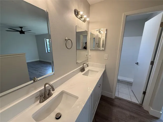 a white toilet sitting next to a bath tub