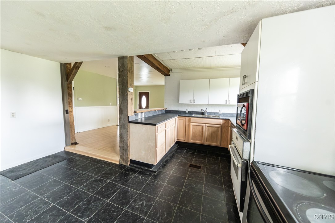 10660 County Route 77, Unit 662 Adams, NY 13605 - Photo 3 of 19 kitchen over looking dinning room