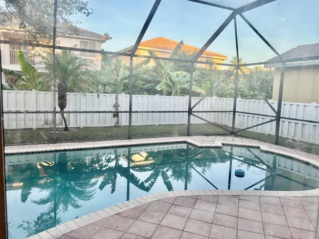 a view of swimming pool with a patio