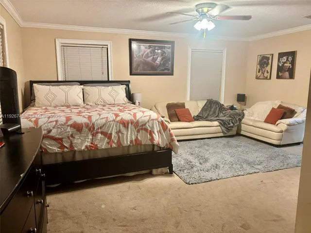 a bedroom with bed and window