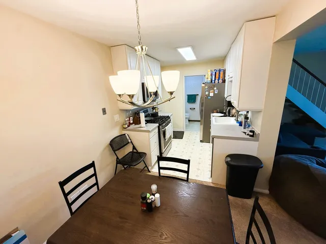 a view of kitchen and dining room with wooden floor