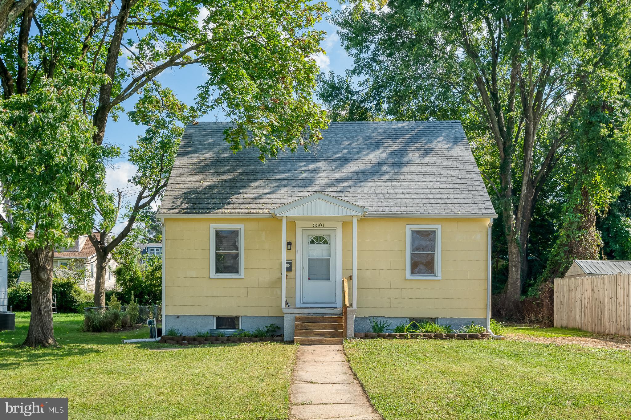 5501 Catalpha Road Baltimore, MD 21214 - Photo 1 of 40 a front view of a house with a yard