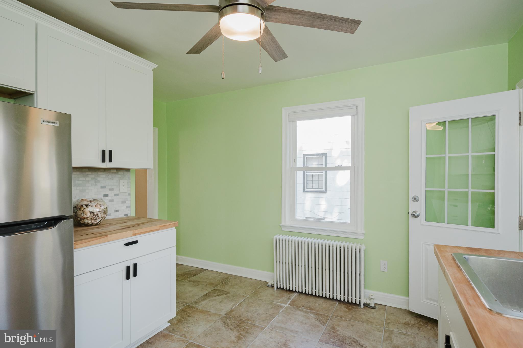 5501 Catalpha Road Baltimore, MD 21214 - Photo 13 of 40 a room with a window and a mirror