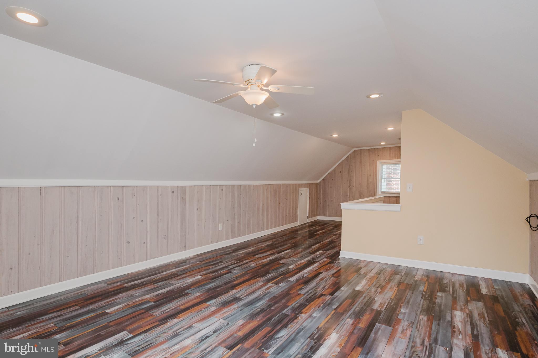 5501 Catalpha Road Baltimore, MD 21214 - Photo 24 of 40 wooden floor in an empty room