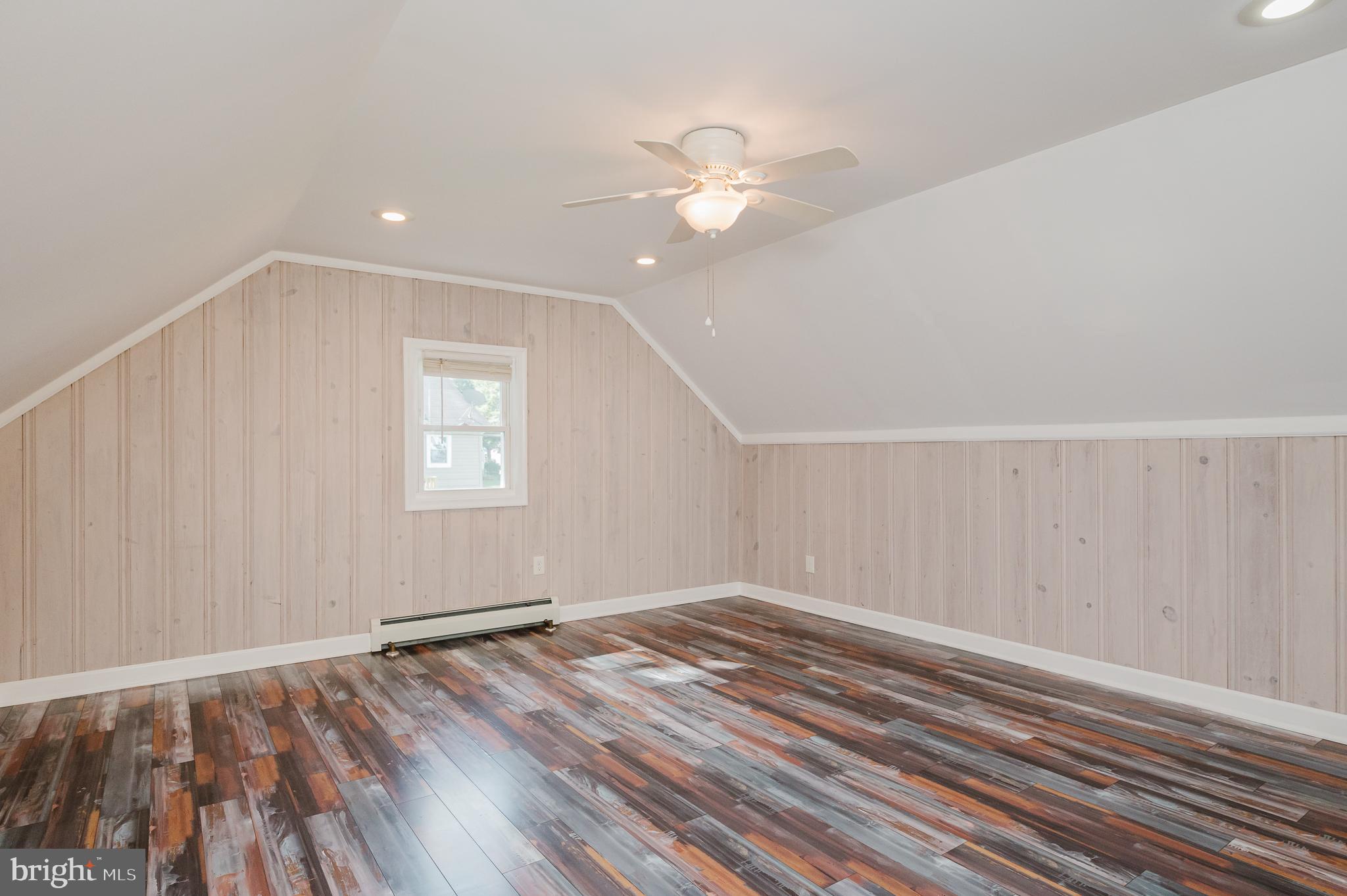 5501 Catalpha Road Baltimore, MD 21214 - Photo 27 of 40 wooden floor in an empty room with a window