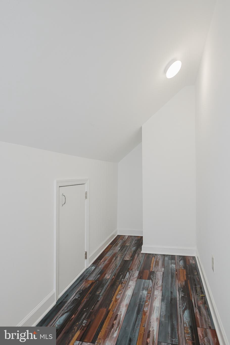 5501 Catalpha Road Baltimore, MD 21214 - Photo 30 of 40 a view of a room with wooden floor