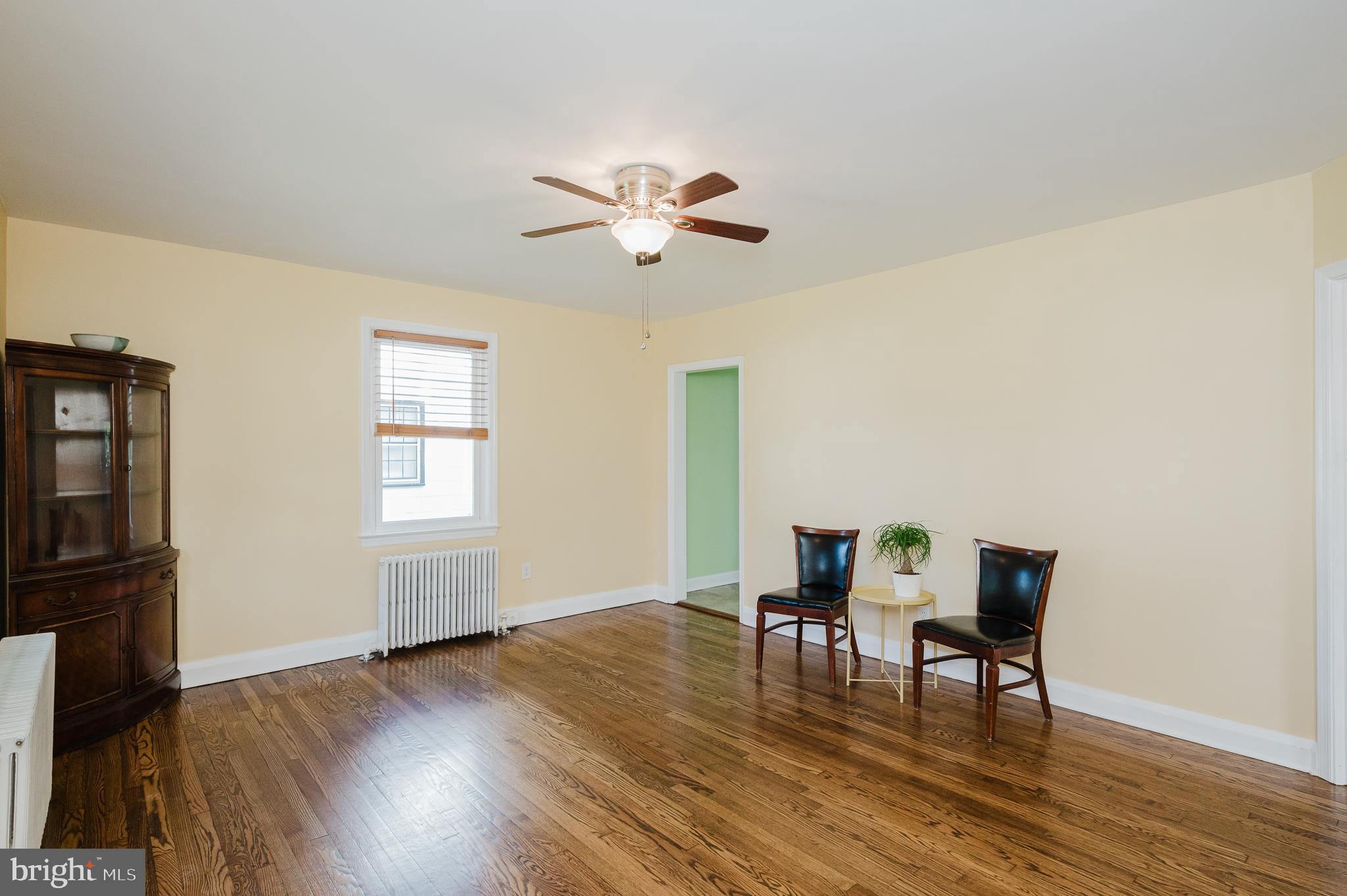 5501 Catalpha Road Baltimore, MD 21214 - Photo 3 of 40 a view of a livingroom with furniture and wooden floor