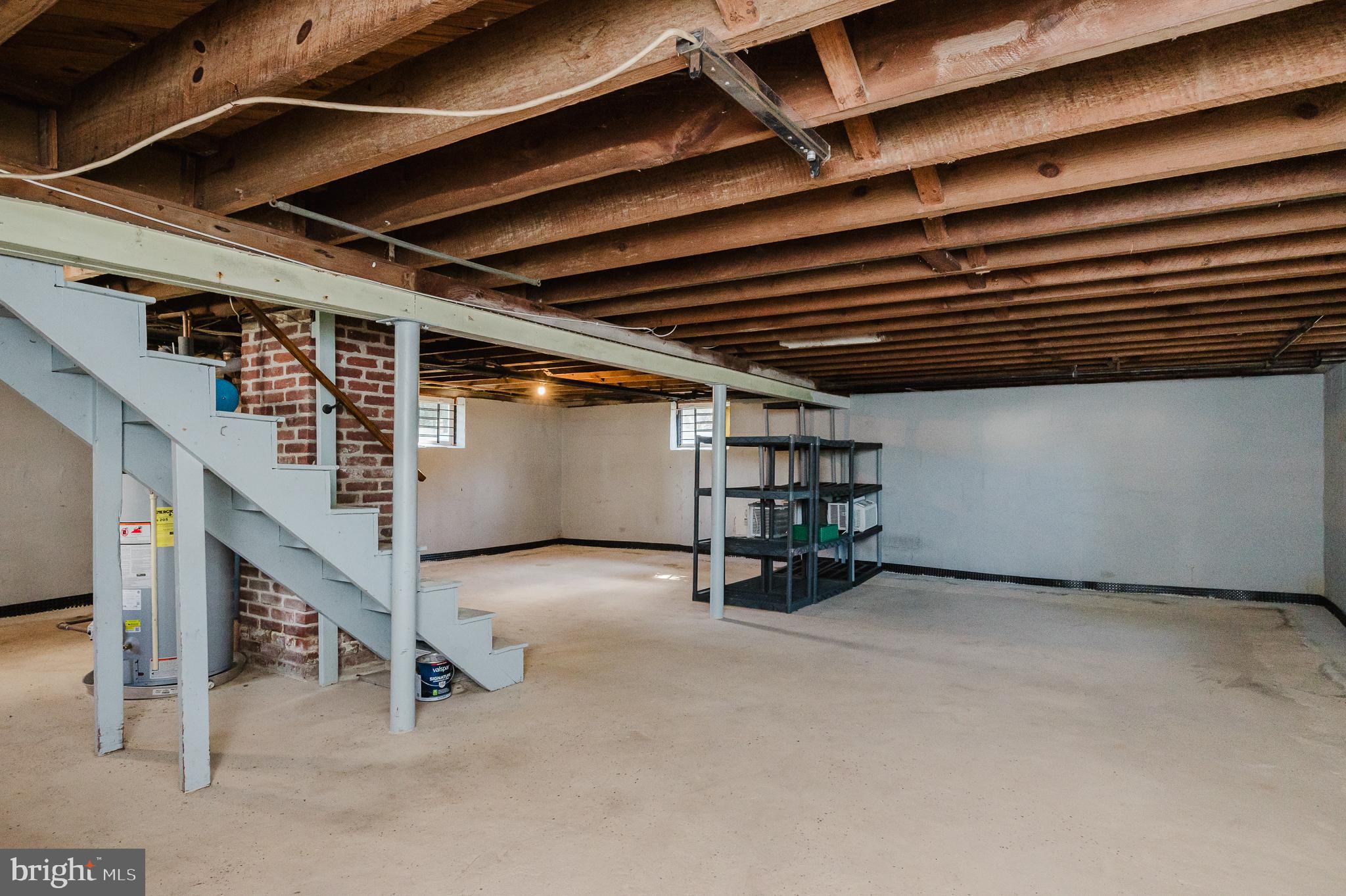 5501 Catalpha Road Baltimore, MD 21214 - Photo 32 of 40 a view of an empty room with stairs