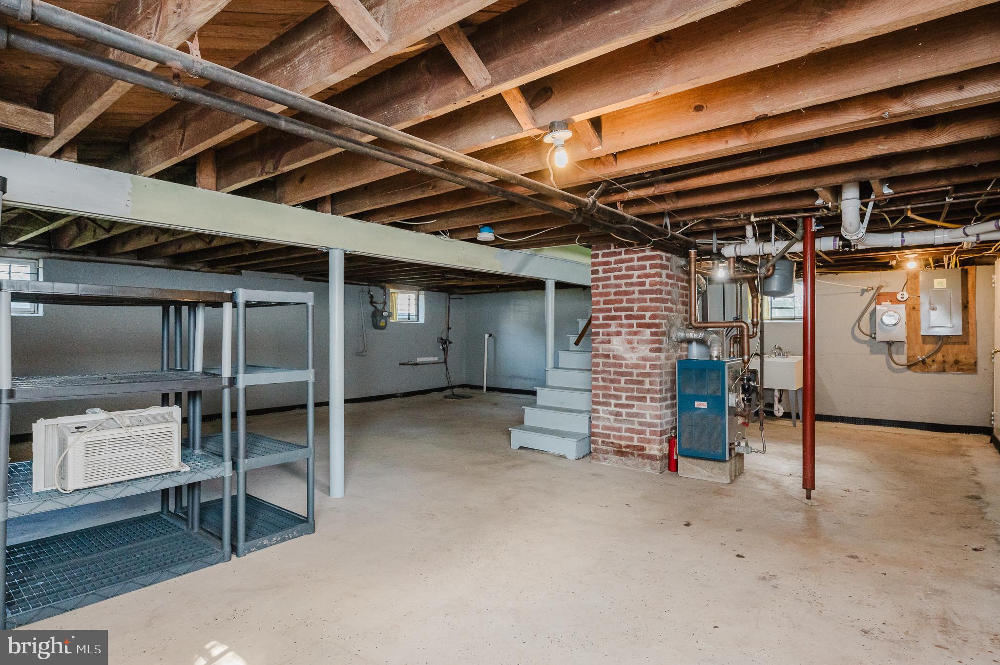 5501 Catalpha Road Baltimore, MD 21214 - Photo 34 of 40 a view of an empty room with storage