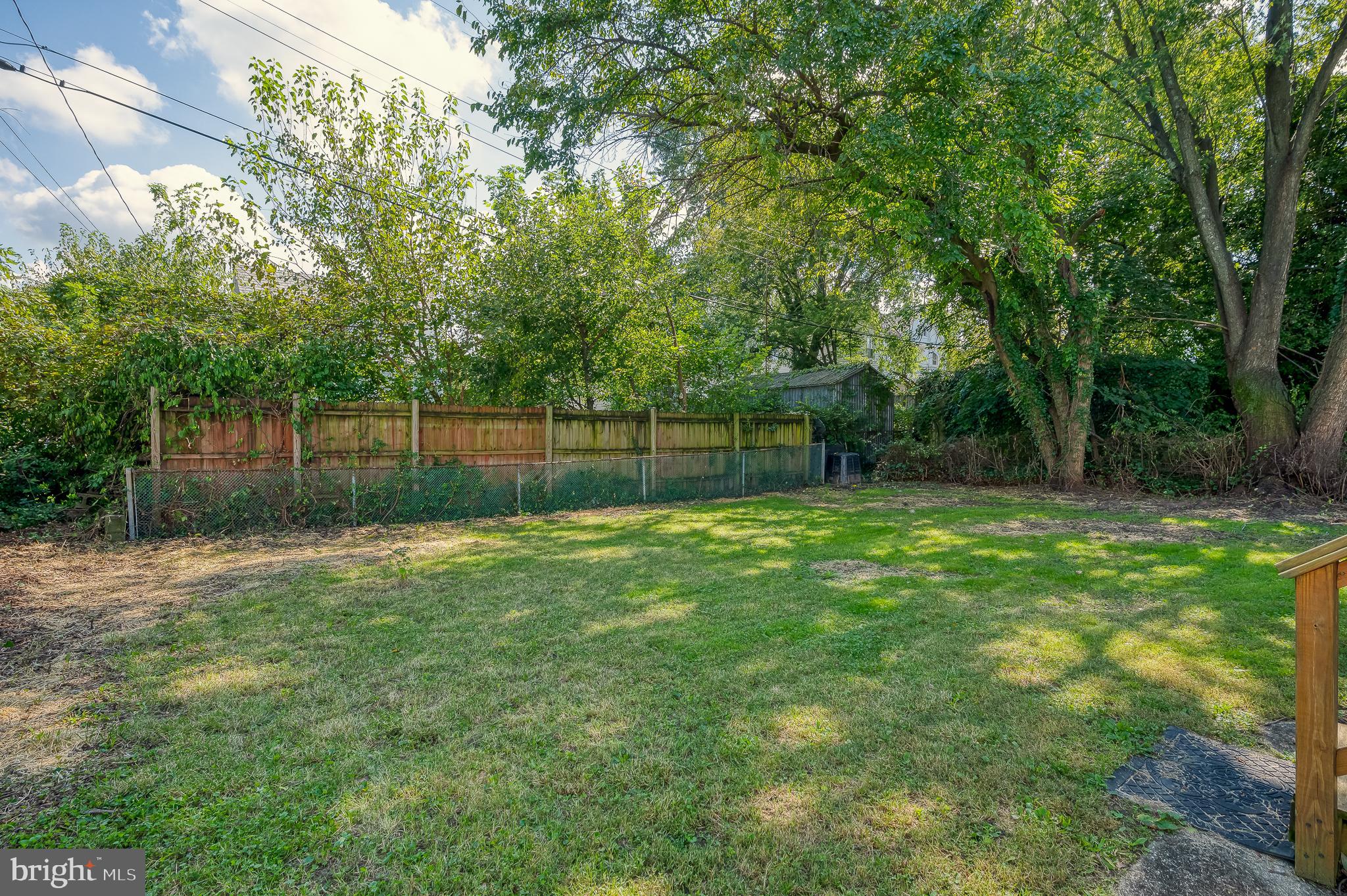 5501 Catalpha Road Baltimore, MD 21214 - Photo 36 of 40 a view of a backyard with a trees