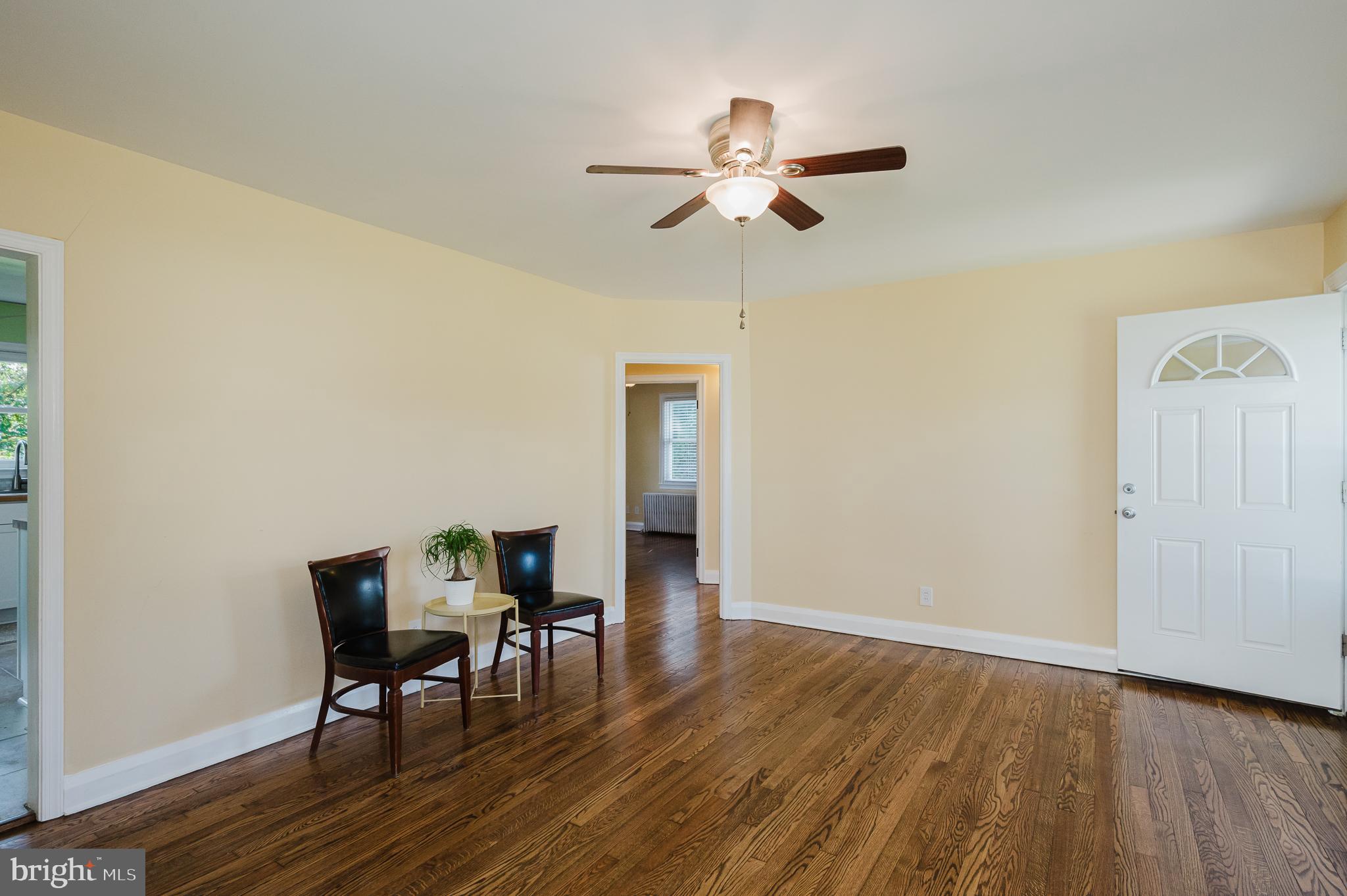 5501 Catalpha Road Baltimore, MD 21214 - Photo 7 of 40 a view of a dining room with furniture and wooden floor
