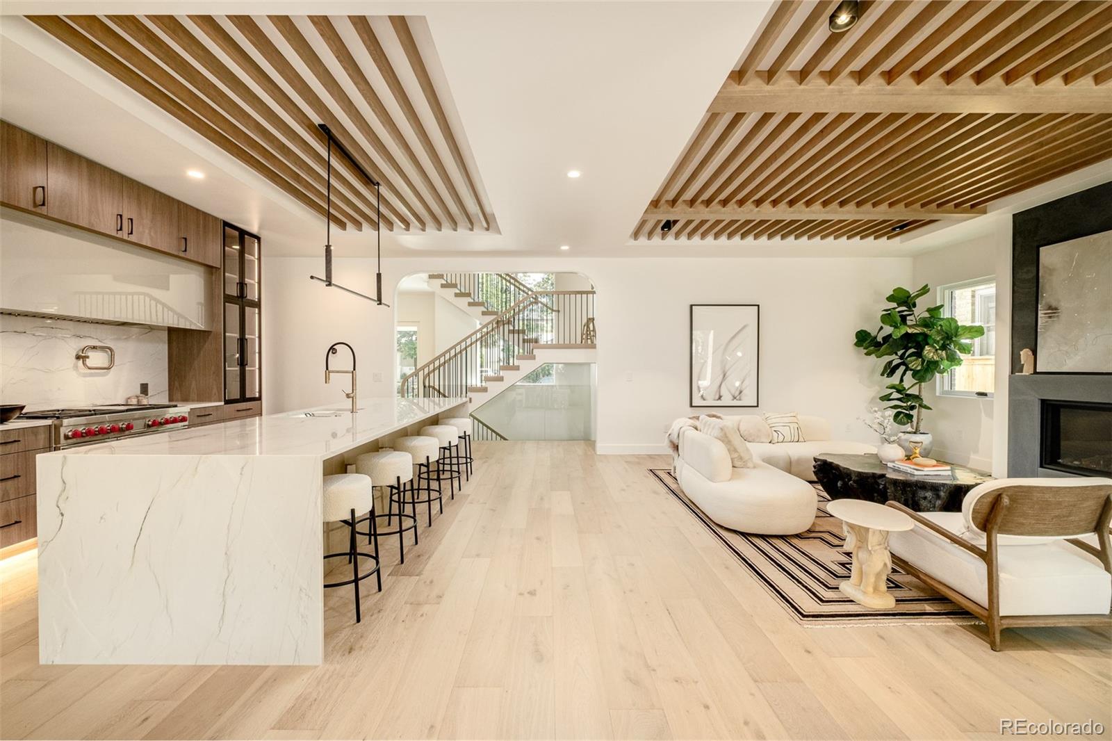 1253 South High Street Denver, CO 80210 - Photo 13 of 46 a living room with furniture and a table