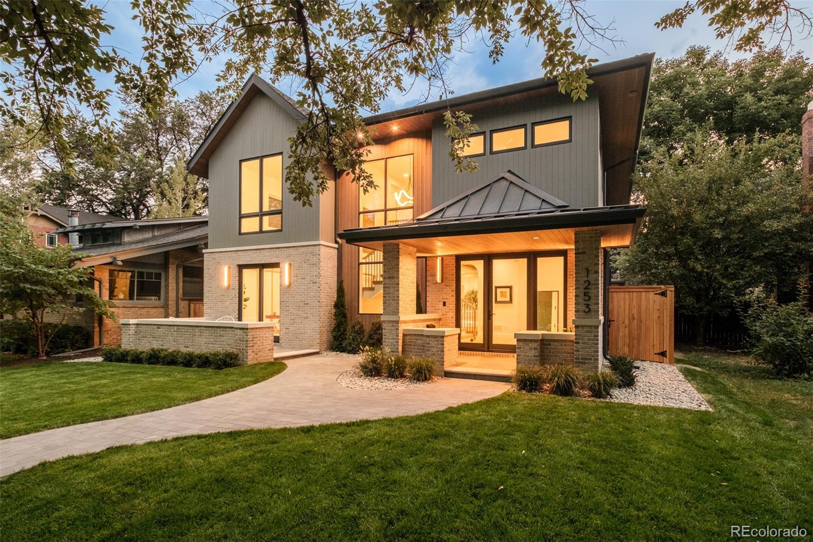 1253 South High Street Denver, CO 80210 - Photo 2 of 46 a front view of building with yard and green space