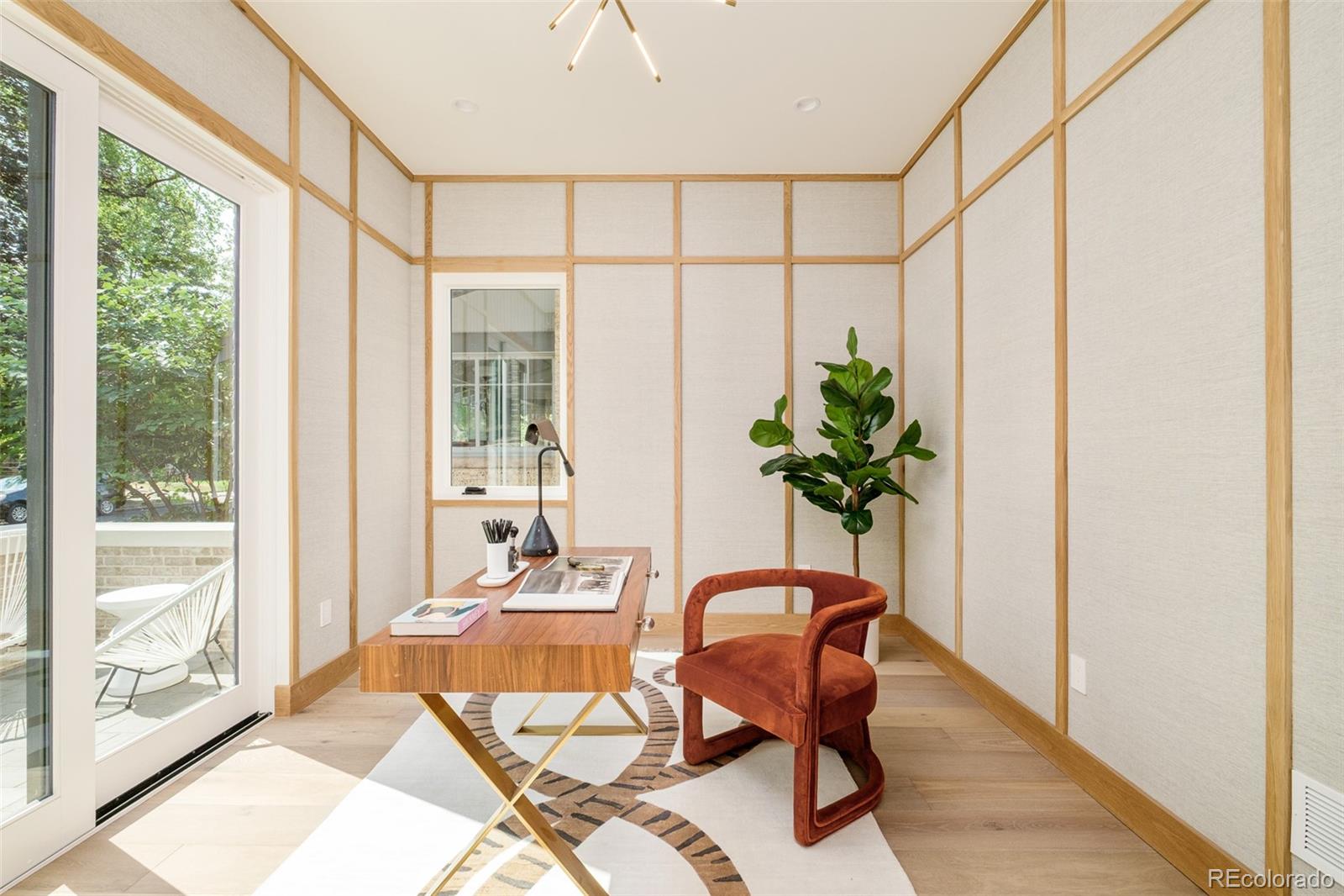 1253 South High Street Denver, CO 80210 - Photo 21 of 46 a living room filled with furniture and a potted plant