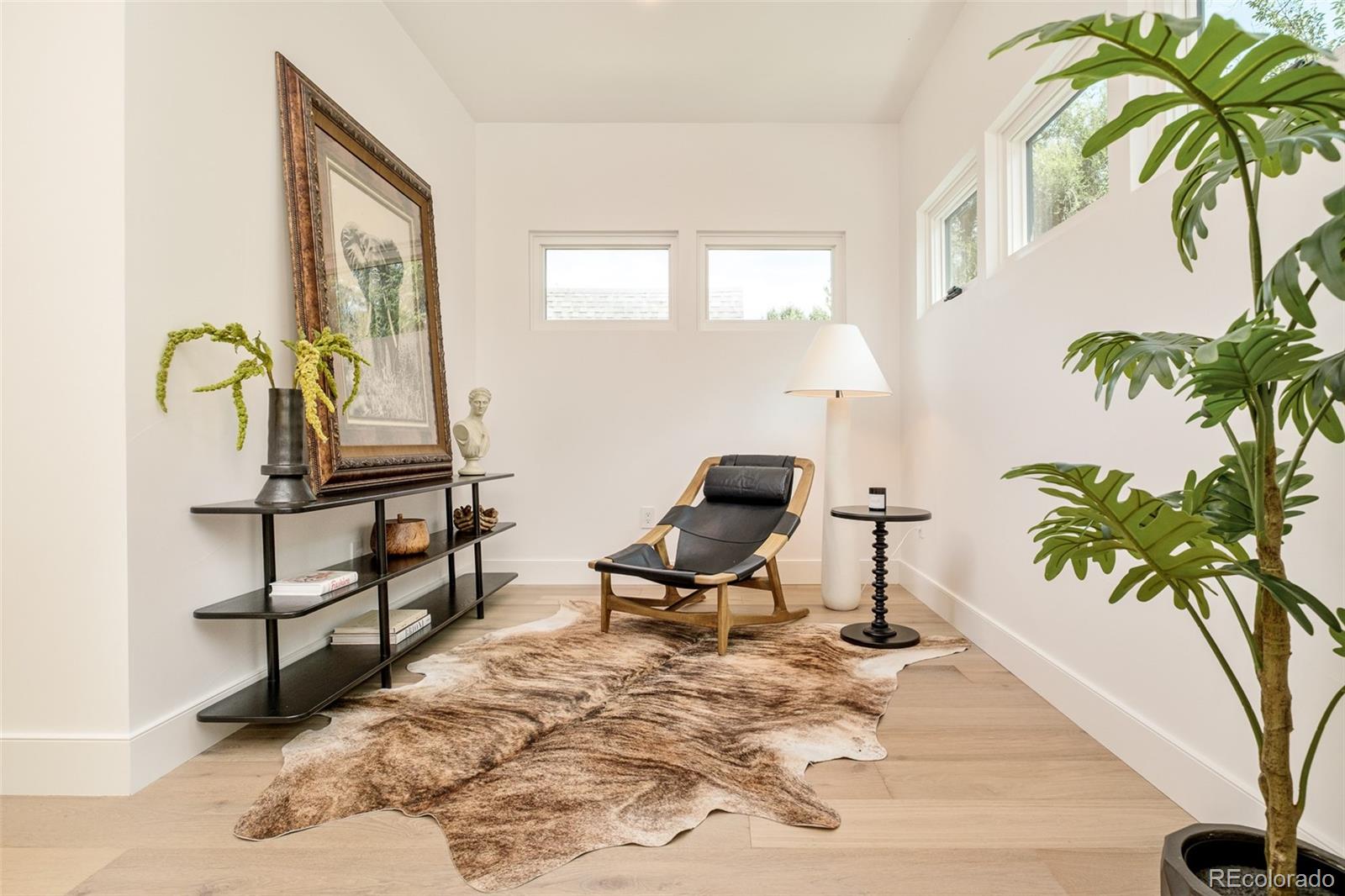 1253 South High Street Denver, CO 80210 - Photo 23 of 46 a living room with furniture